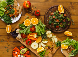 Normal_wooden-table-served-with-cut-fruits-and-vegetables-2025-03-18-19-06-48-utc